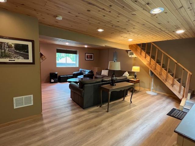 1910 Longwood Point Rd NE, Outing, MN 56662 - living area featuring wooden ceiling, stairs, recessed lighting, and wood finished floors