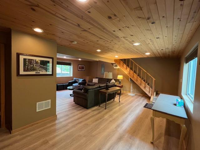 1910 Longwood Point Rd NE, Outing, MN 56662 - living room featuring stairs, recessed lighting, wood ceiling, light wood-type flooring, and baseboards