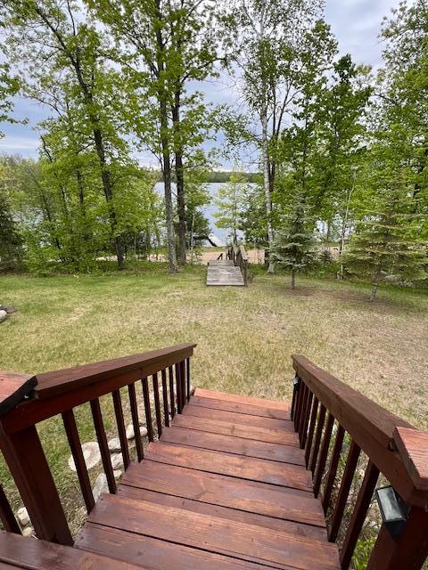 1910 Longwood Point Rd NE, Outing, MN 56662 - wooden deck featuring a yard