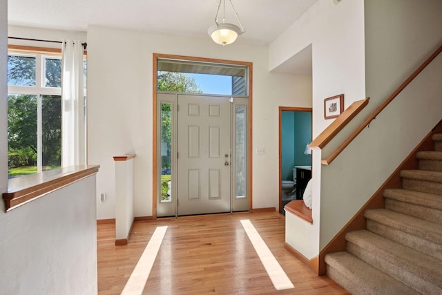 1780 Quail Dr, Shakopee, MN 55379 - foyer with stairway, light wood-style flooring, and baseboards