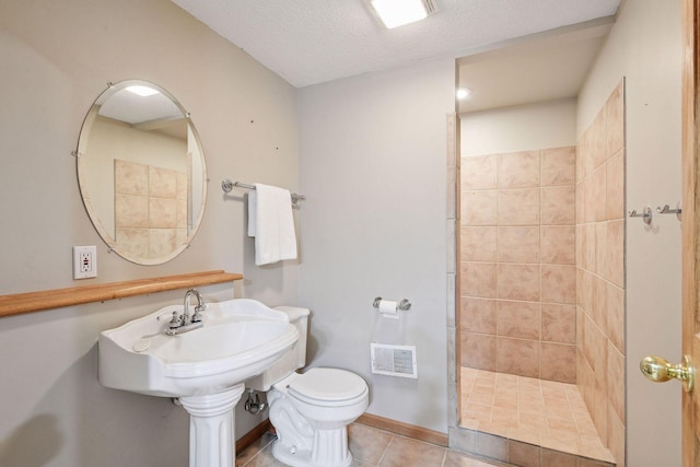 1780 Quail Dr, Shakopee, MN 55379 - full bath with a shower stall, toilet, tile patterned flooring, and a textured ceiling