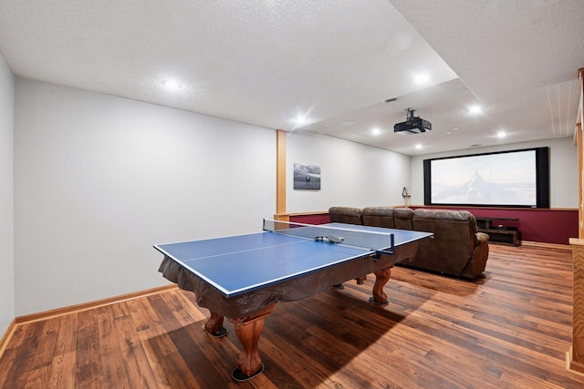 1780 Quail Dr, Shakopee, MN 55379 - rec room with wood finished floors, recessed lighting, baseboards, and a textured ceiling
