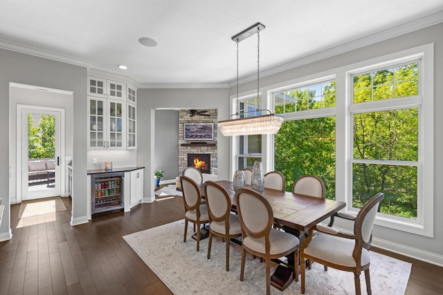 5980 Prestwick Ct, Shorewood, MN 55331 - dining space with wine cooler, healthy amount of natural light, baseboards, a fireplace, and ornamental molding