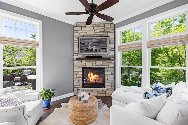 5980 Prestwick Ct, Shorewood, MN 55331 - living area featuring crown molding, a stone fireplace, wood finished floors, a ceiling fan, and baseboards