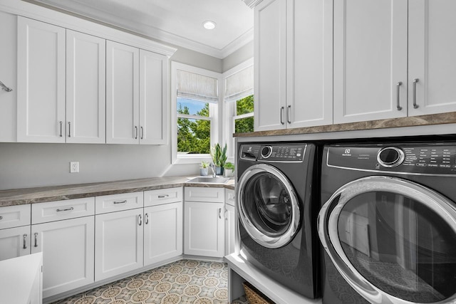 5980 Prestwick Ct, Shorewood, MN 55331 - laundry room featuring washing machine and clothes dryer, cabinet space, and ornamental molding