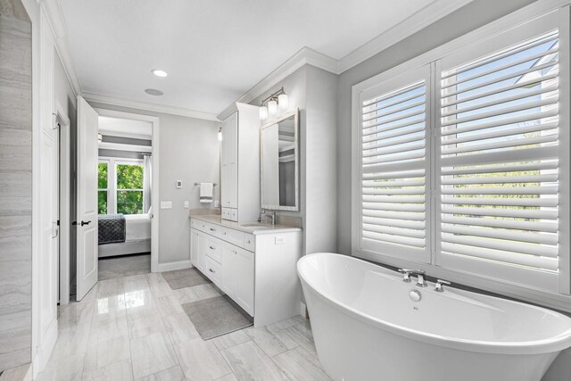 5980 Prestwick Ct, Shorewood, MN 55331 - bathroom featuring crown molding, vanity, ensuite bath, a freestanding tub, and marble look tile flooring