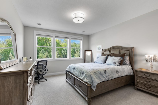 5980 Prestwick Ct, Shorewood, MN 55331 - bedroom featuring light colored carpet, multiple windows, an office area, and baseboards