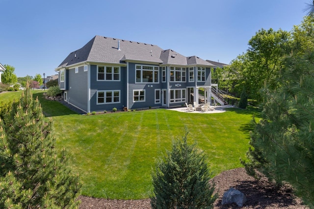 5980 Prestwick Ct, Shorewood, MN 55331 - back of property featuring a patio, stairs, a lawn, and a shingled roof