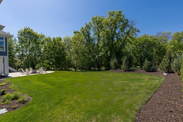 5980 Prestwick Ct, Shorewood, MN 55331 - view of green lawn featuring a patio and a fire pit