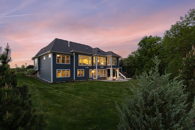 5980 Prestwick Ct, Shorewood, MN 55331 - rear view of property featuring a lawn, a patio area, and roof with shingles