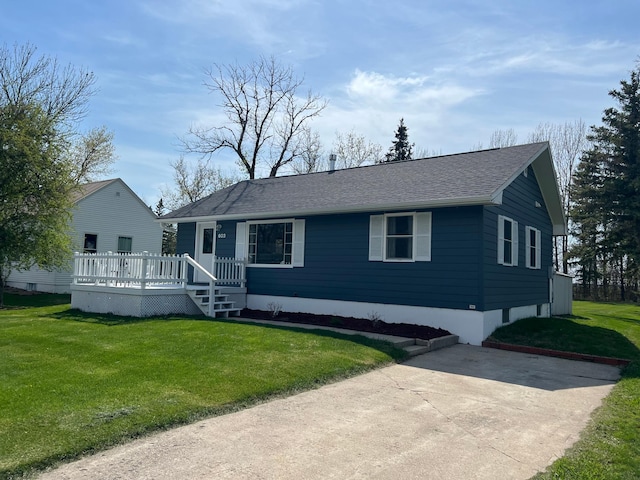 603 Main Ave N, Roseau, MN 56751 - view of front of property featuring a deck, a front yard, and a shingled roof