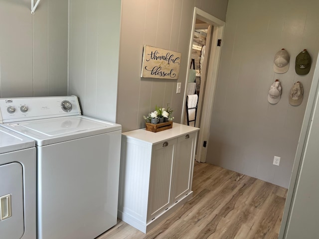 603 Main Ave N, Roseau, MN 56751 - clothes washing area featuring light wood-type flooring and washer and clothes dryer