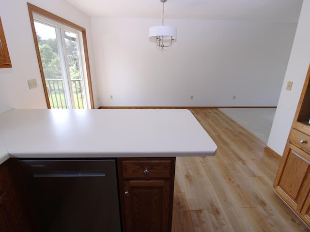 538 Nordic Ln, Troy Twp, WI 54016 - kitchen featuring dishwasher, light wood-style floors, a peninsula, pendant lighting, and light countertops