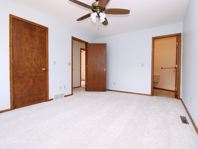 538 Nordic Ln, Troy Twp, WI 54016 - unfurnished bedroom with light carpet, baseboards, ceiling fan, and ensuite bath