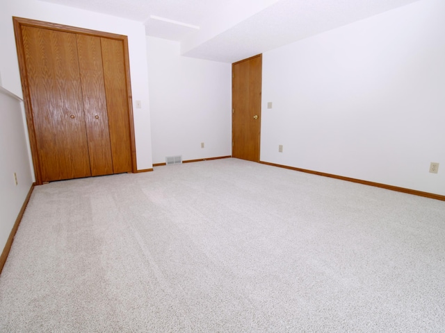 538 Nordic Ln, Troy Twp, WI 54016 - unfurnished bedroom with light colored carpet, baseboards, and a closet