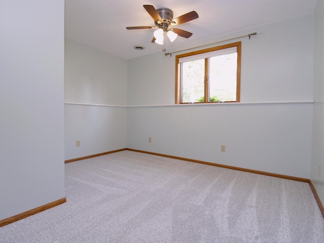 538 Nordic Ln, Troy Twp, WI 54016 - unfurnished room with carpet floors, baseboards, and a ceiling fan