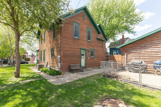 210 1st St SE, Hayfield, MN 55940 - back of house featuring cooling unit and entry steps