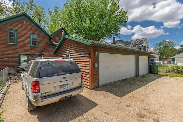 210 1st St SE, Hayfield, MN 55940 - detached garage featuring fence
