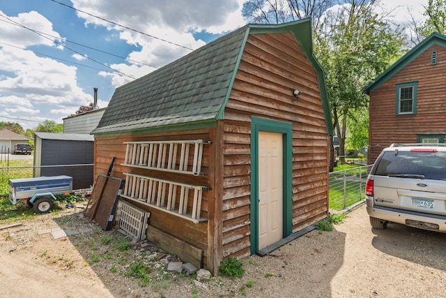 210 1st St SE, Hayfield, MN 55940 - view of outdoor structure with fence and an outdoor structure
