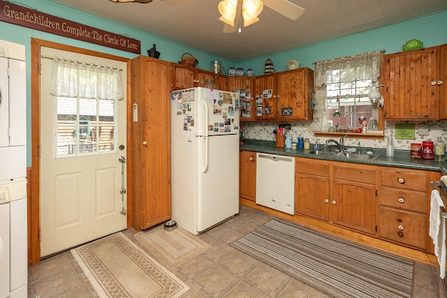 210 1st St SE, Hayfield, MN 55940 - kitchen with white appliances, a sink, plenty of natural light, and brown cabinetry