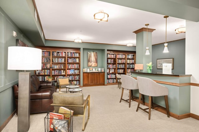 carpeted office with bookshelves and baseboards