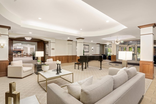 building lobby with recessed lighting, a decorative wall, and a wainscoted wall