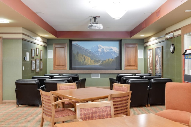 cinema room featuring light colored carpet