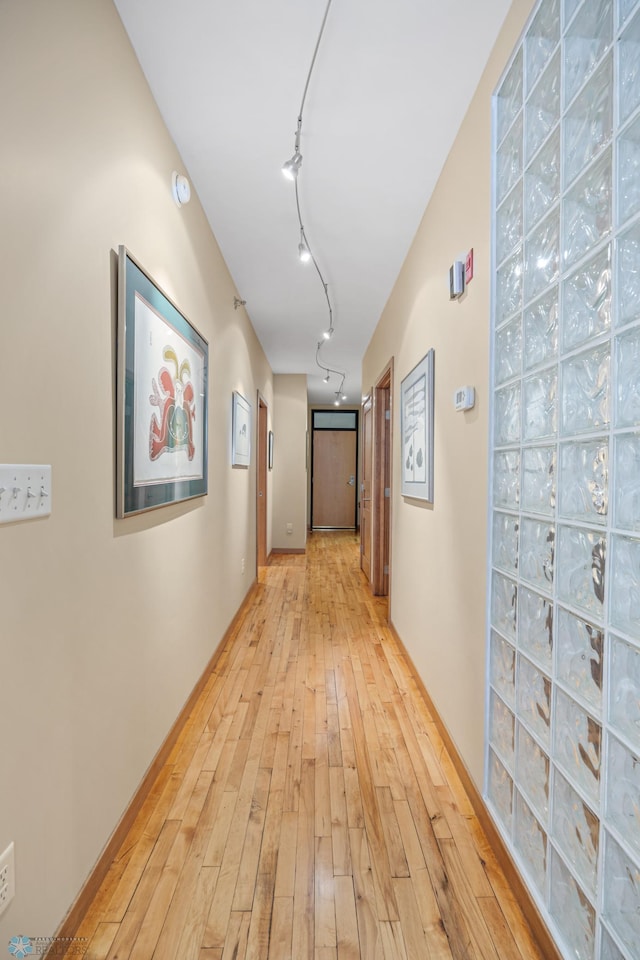 300 Broadway N Unit 204, Fargo, ND 58102 - hallway featuring light wood-style flooring and track lighting
