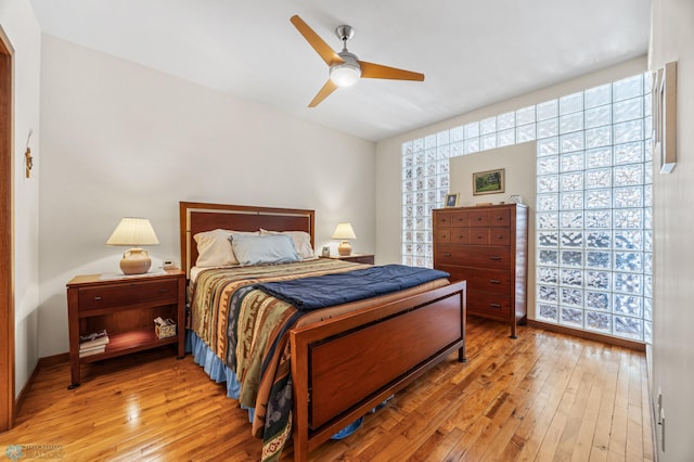 300 Broadway N Unit 204, Fargo, ND 58102 - bedroom with light wood finished floors and ceiling fan