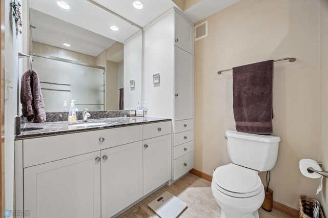 300 Broadway N Unit 204, Fargo, ND 58102 - bathroom featuring baseboards, toilet, vanity, and recessed lighting