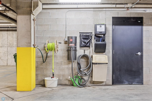 300 Broadway N Unit 204, Fargo, ND 58102 - kitchen with unfinished concrete floors and concrete block wall