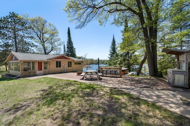 6363 Circle Rd, Danbury, WI 54830 - rear view of property with a patio area, a yard, a water view, and a sunroom