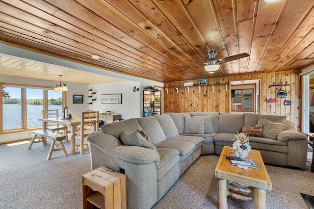 6363 Circle Rd, Danbury, WI 54830 - living room with wood ceiling, carpet floors, a water view, wood walls, and ceiling fan