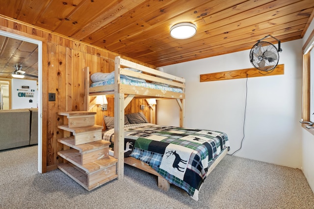 6363 Circle Rd, Danbury, WI 54830 - carpeted bedroom with wood walls and wooden ceiling