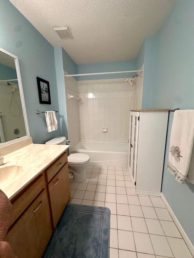 full bath featuring tile patterned flooring, a textured ceiling, vanity, toilet, and bathtub / shower combination