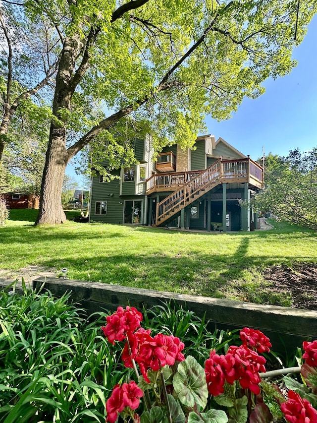 view of grassy yard featuring a wooden deck