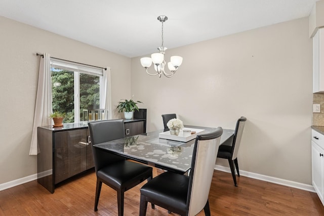13967 Herald Ct, Apple Valley, MN 55124 - dining room with a chandelier, baseboards, and light wood-style floors