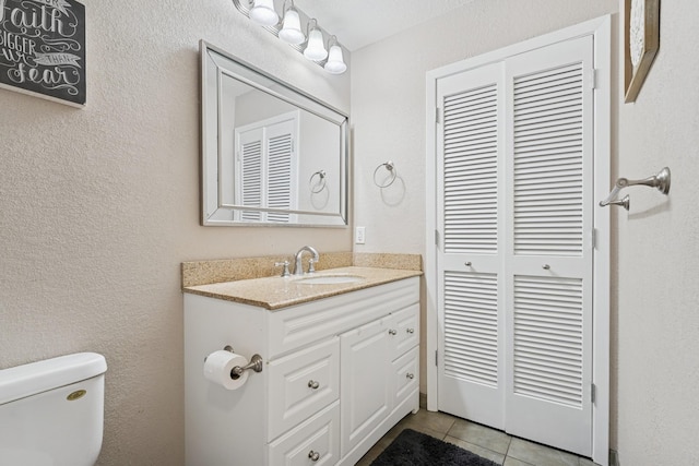 13967 Herald Ct, Apple Valley, MN 55124 - bathroom with toilet, tile patterned floors, and vanity