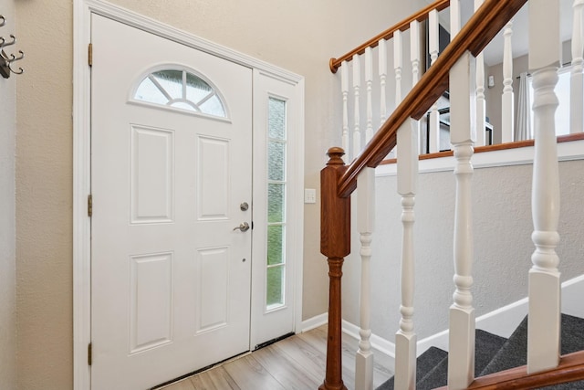 13967 Herald Ct, Apple Valley, MN 55124 - entryway featuring wood finished floors and stairs