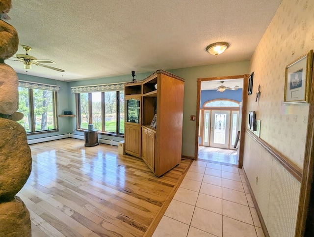 24944 State Highway 210, Mcgregor, MN 55760 - entrance foyer with ceiling fan, healthy amount of natural light, a textured ceiling, wallpapered walls, and light wood-style flooring