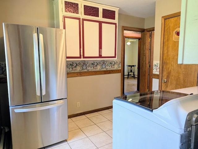 24944 State Highway 210, Mcgregor, MN 55760 - kitchen with freestanding refrigerator and light tile patterned floors