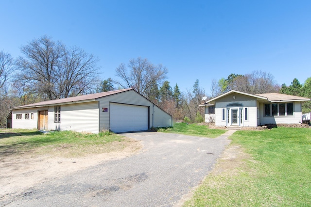 24944 State Highway 210, Mcgregor, MN 55760 - single story home featuring a garage, a front yard, and an outdoor structure