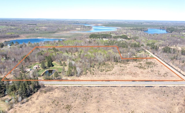 24944 State Highway 210, Mcgregor, MN 55760 - aerial view of property and surrounding area featuring a nearby body of water, property boundaries highlighted, and a heavily wooded area