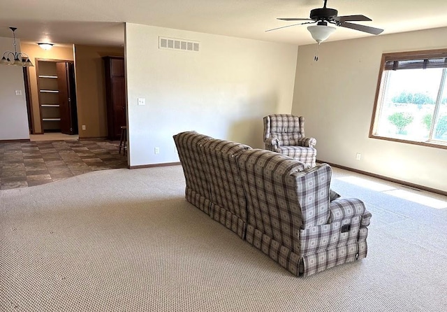 413 River Bluff Dr, Windom, MN 56101 - living area featuring carpet flooring, baseboards, and a ceiling fan