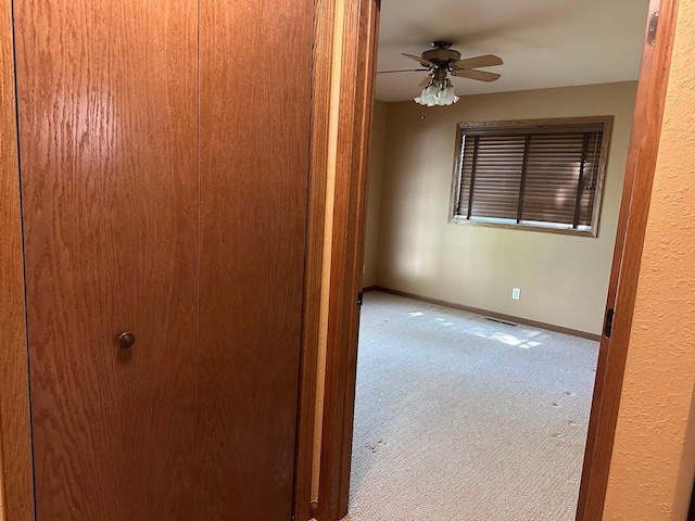 413 River Bluff Dr, Windom, MN 56101 - empty room featuring carpet flooring, a ceiling fan, and baseboards