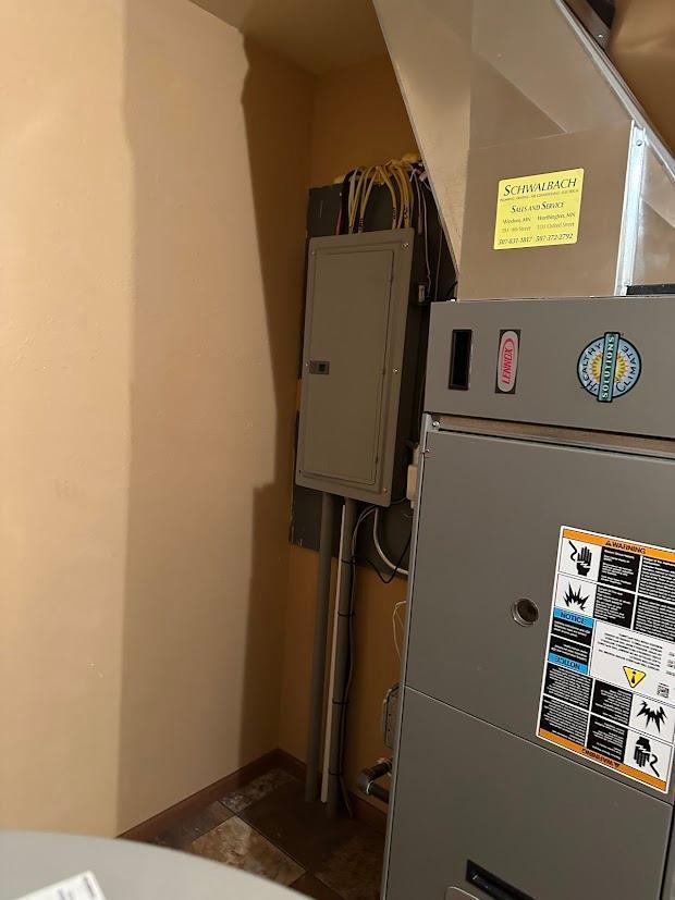413 River Bluff Dr, Windom, MN 56101 - utility room with heating unit and electric panel