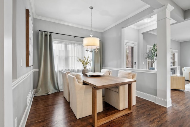 5220 Abbott Ave S, Minneapolis, MN 55410 - dining room with dark wood-type flooring, ornate columns, ornamental molding, and baseboards