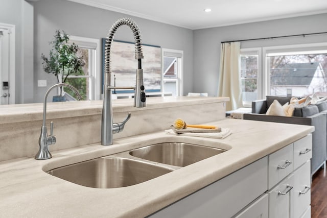 5220 Abbott Ave S, Minneapolis, MN 55410 - kitchen with a sink, white cabinets, healthy amount of natural light, recessed lighting, and crown molding