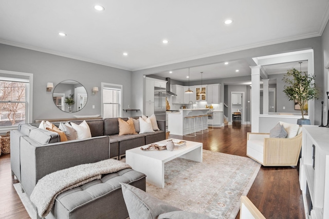 5220 Abbott Ave S, Minneapolis, MN 55410 - living area featuring decorative columns, dark wood finished floors, recessed lighting, and crown molding