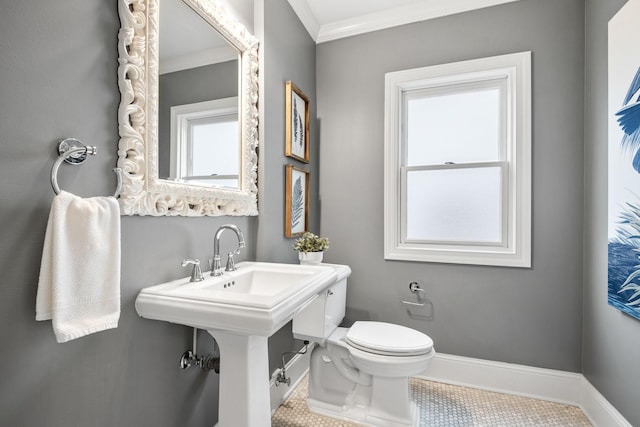 5220 Abbott Ave S, Minneapolis, MN 55410 - bathroom featuring ornamental molding, toilet, tile patterned floors, and baseboards